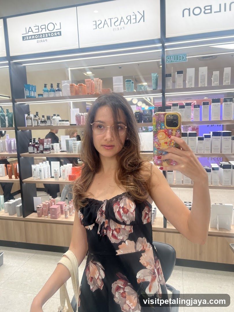 Woman taking a mirror selfie in a salon