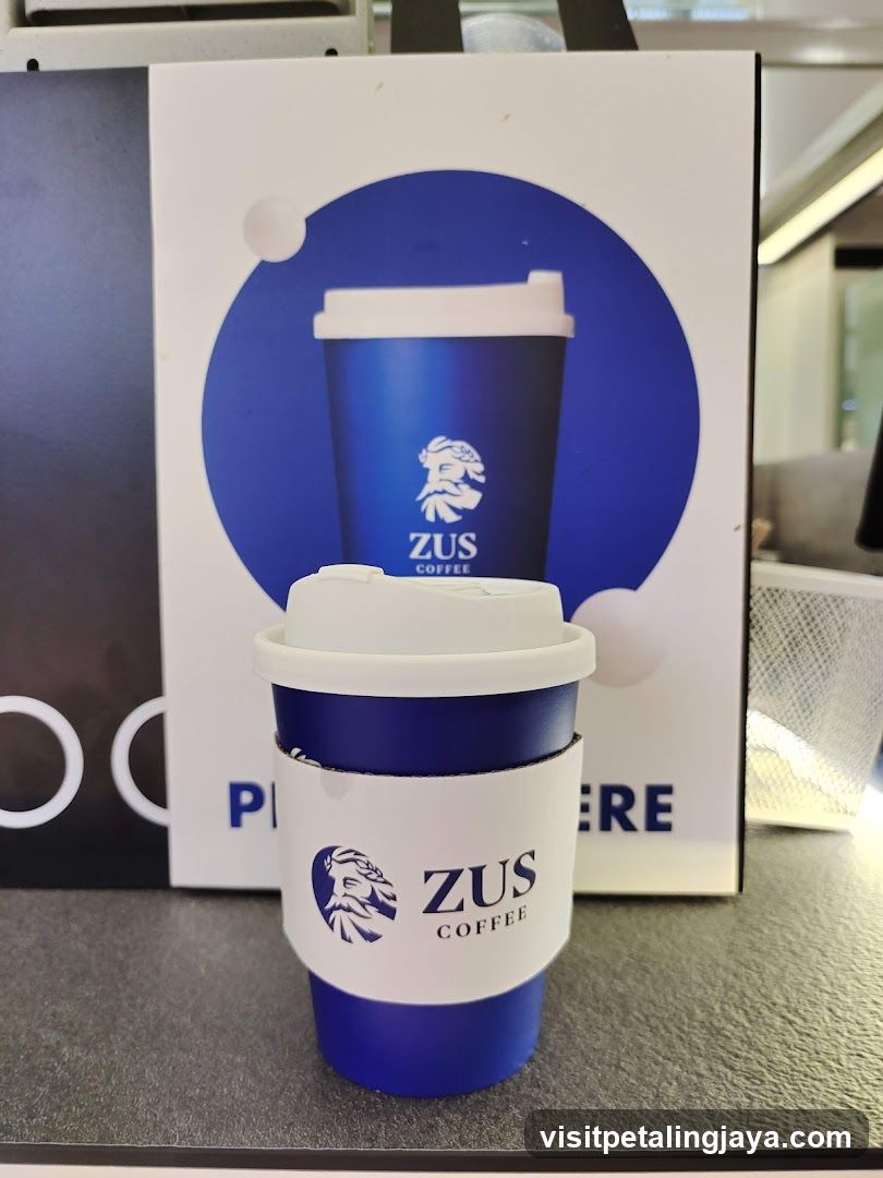 ZUS Coffee Cup and Advertisement