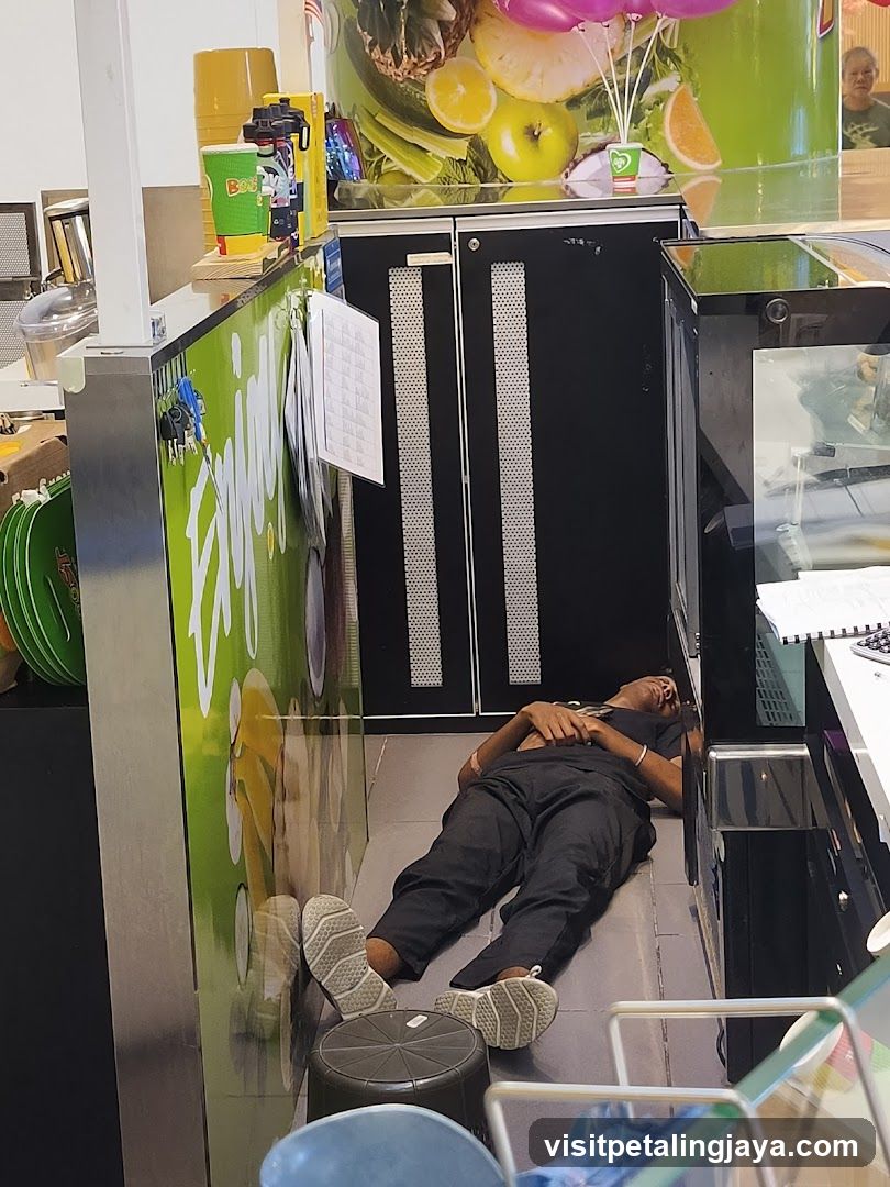 Man sleeping at juice bar counter