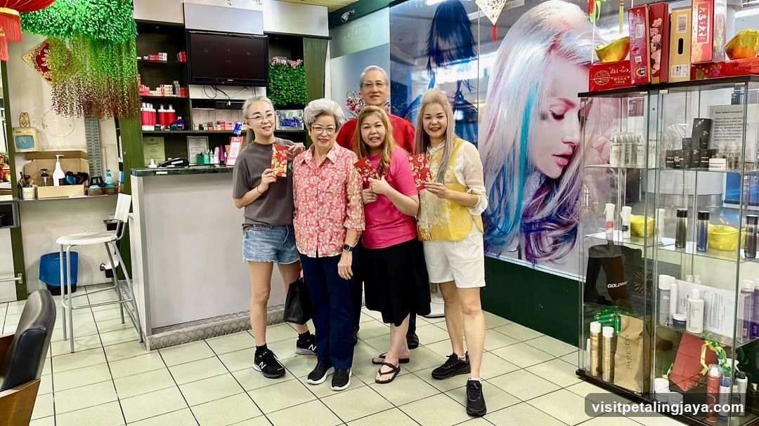 People holding red envelopes inside a salon