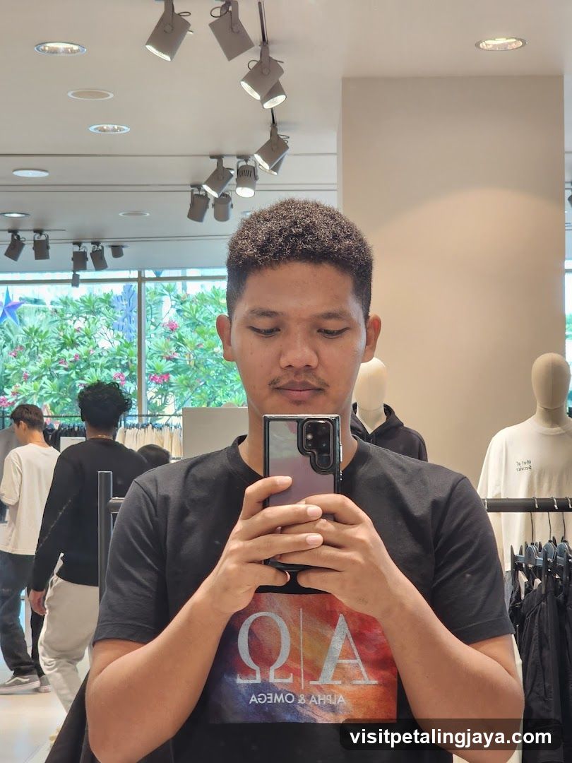 Man taking a selfie in a clothing store