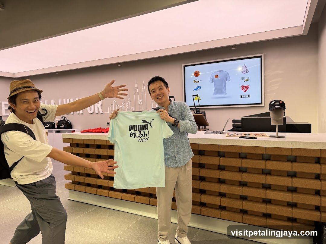 Two men in a store holding a t-shirt