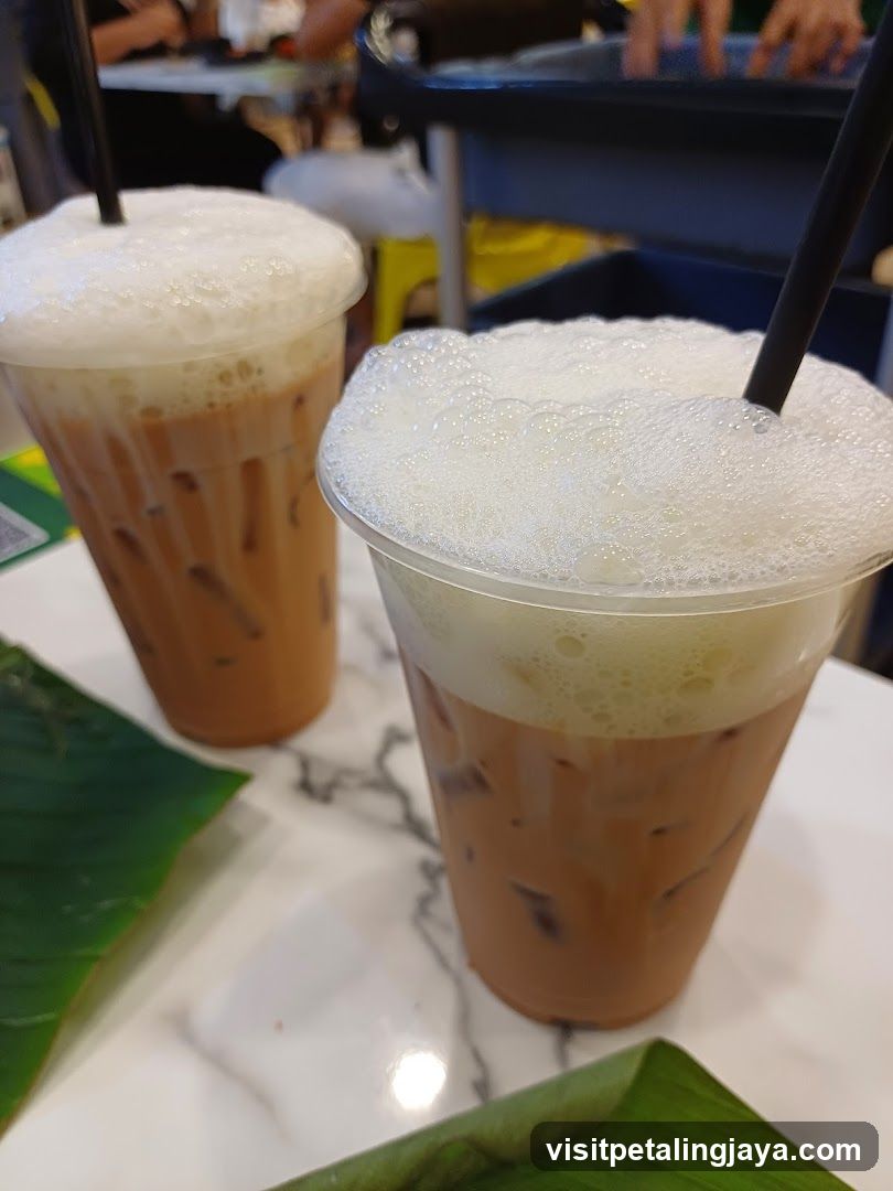 Two iced drinks with foam