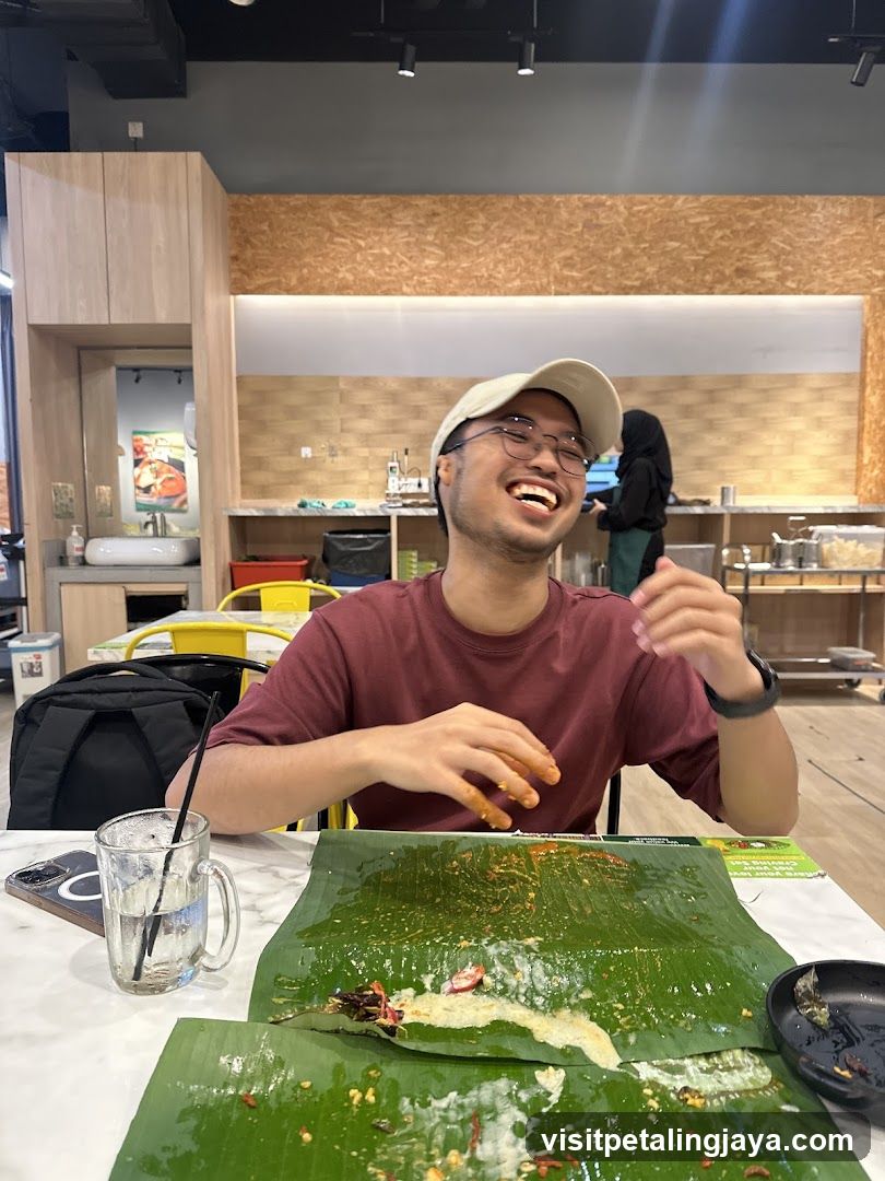 Man laughing while eating