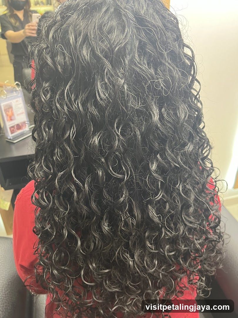 Woman with long curly dark hair