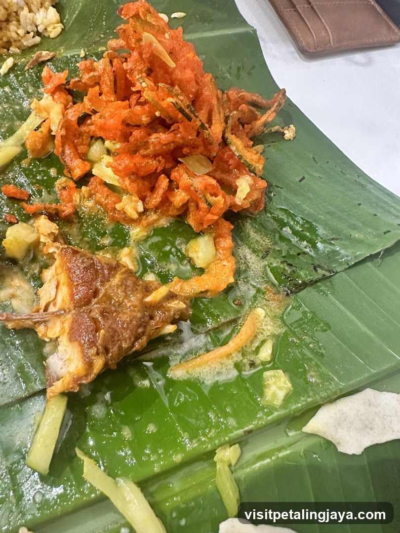 Fried Vegetables and Fish on Banana Leaf