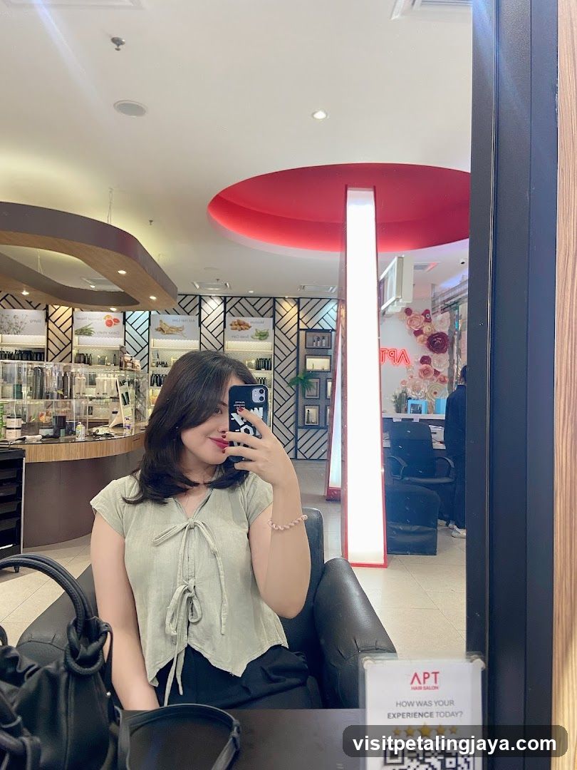 Woman taking a selfie in a salon