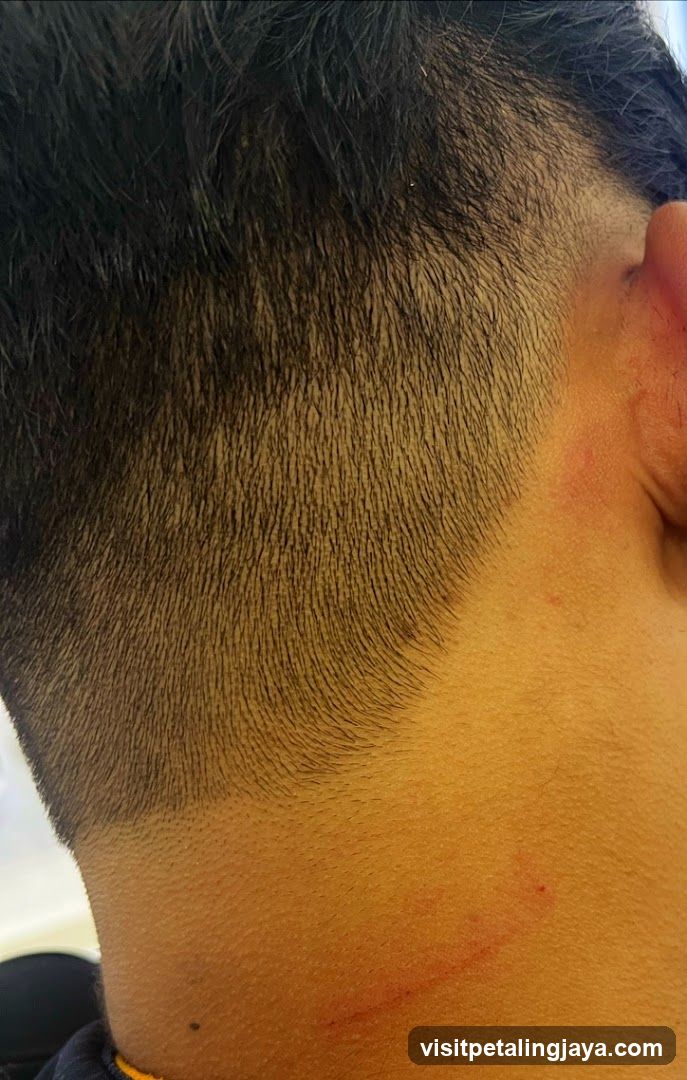 Close-up of a person's neck and hairline
