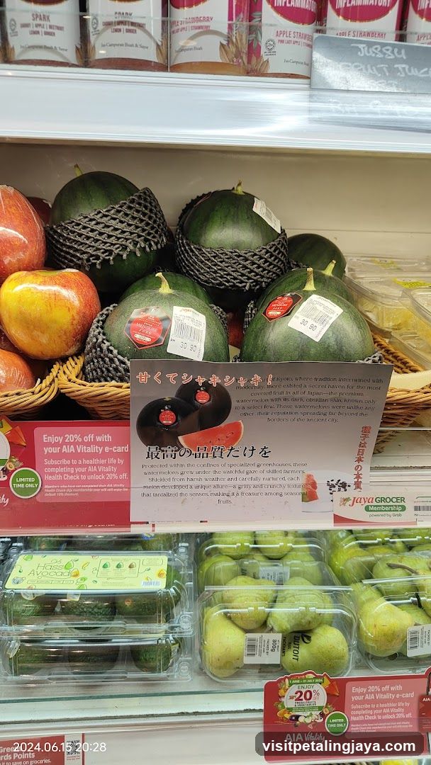 Watermelons and other fruits in a grocery store