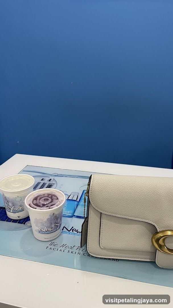Two drinks and a handbag on a counter