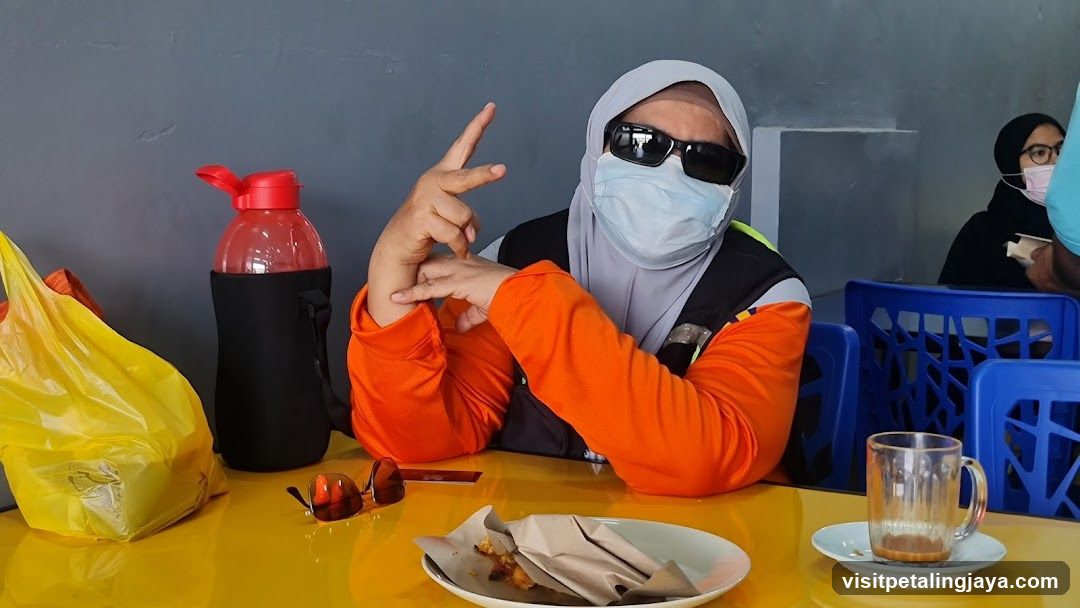 Person posing at a table
