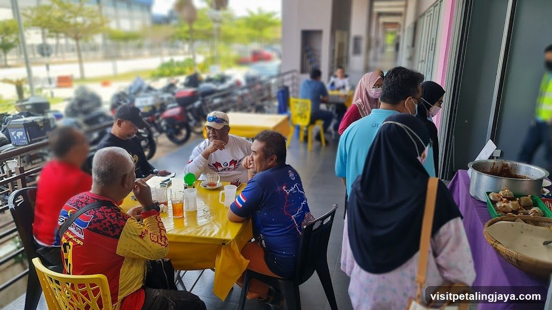 Outdoor dining area with people and food