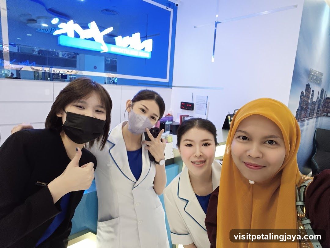 Four people posing for a selfie