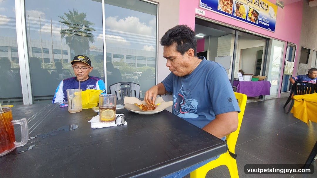 People eating at an outdoor restaurant