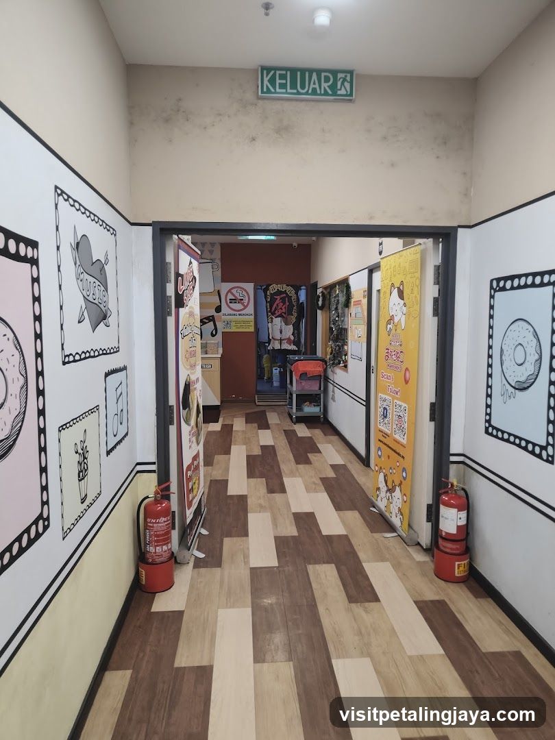 Hallway with cartoon art and fire extinguishers