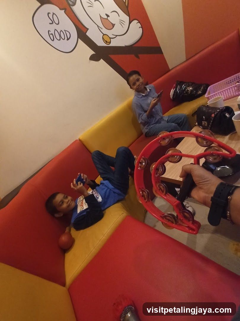 Children playing in a colorful booth