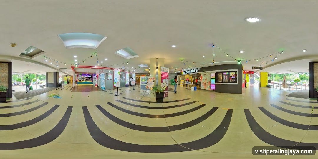 Indoor shopping mall corridor with McDonald's