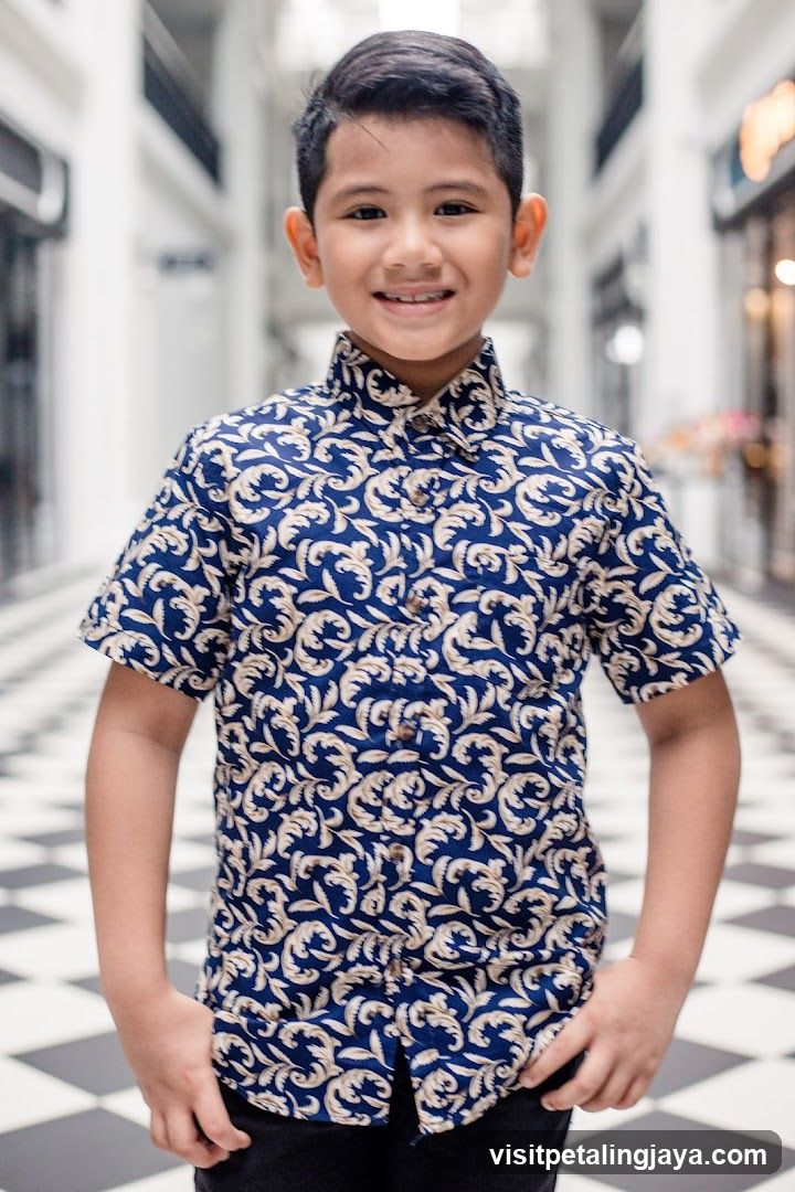 Young boy in patterned shirt