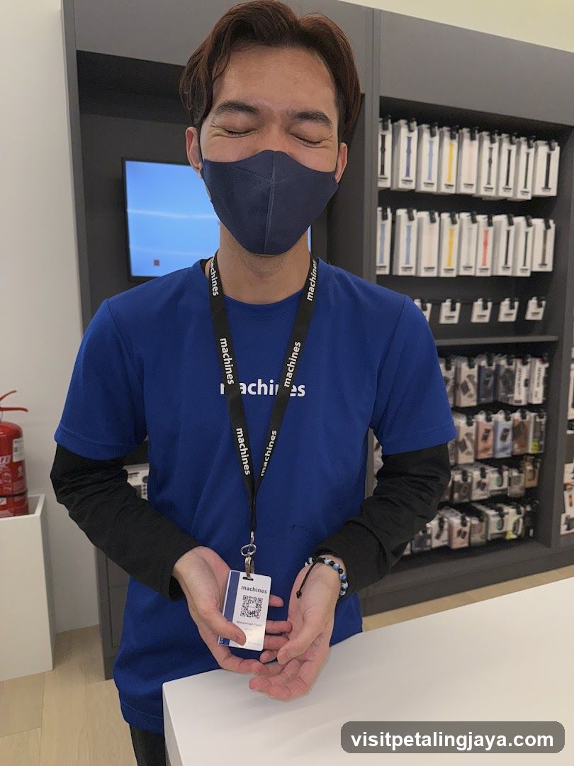 Employee holding a QR code card