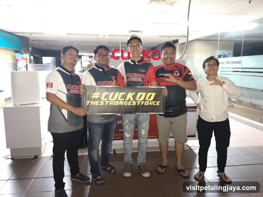Group holding a CUCKOO sign