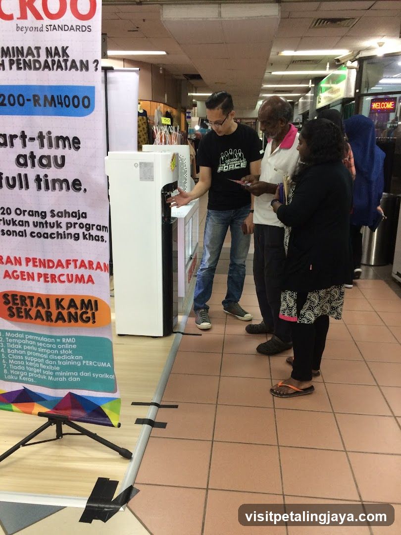 People interacting at a booth