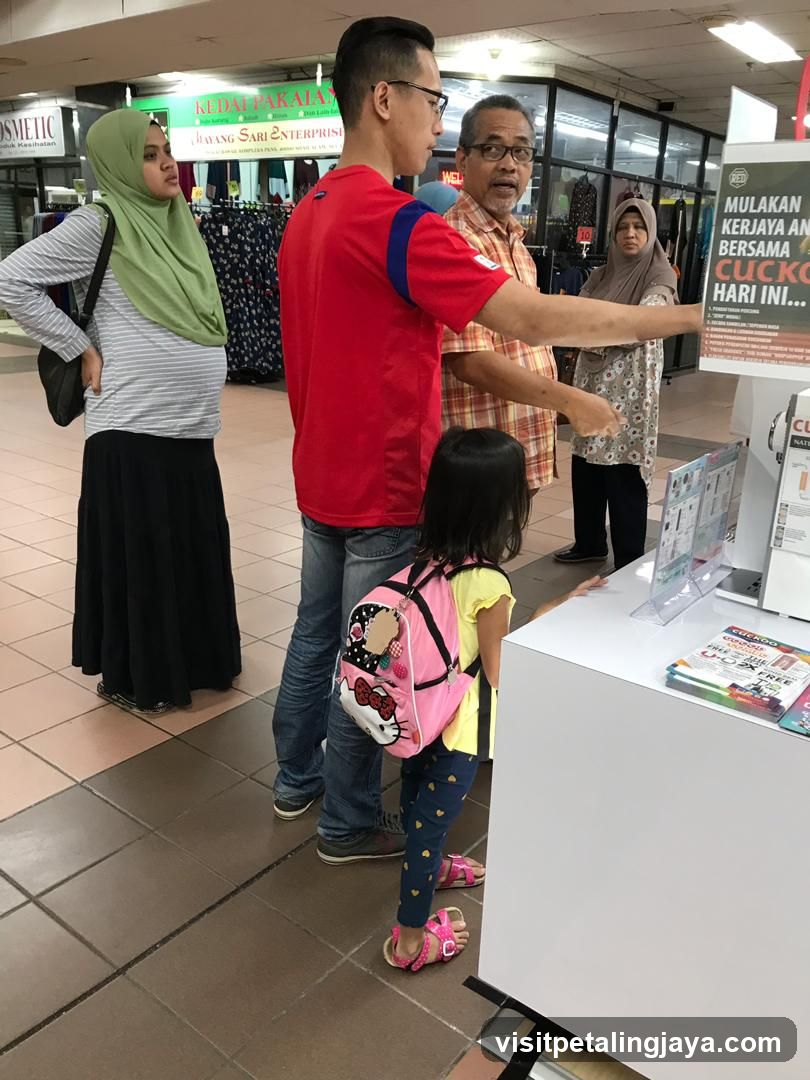 People looking at a display