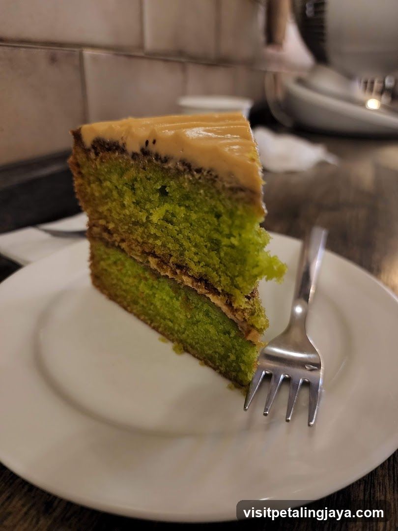 Slice of Green Cake with Caramel Frosting
