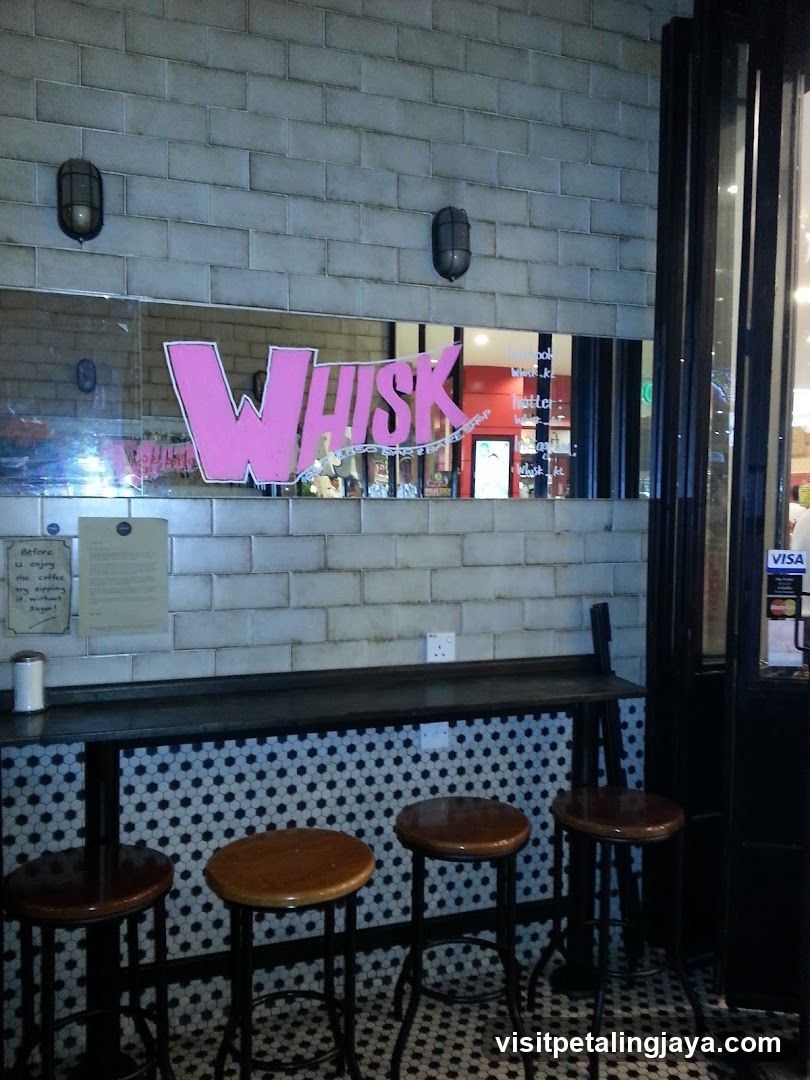 Interior of a cafe with a bar and stools