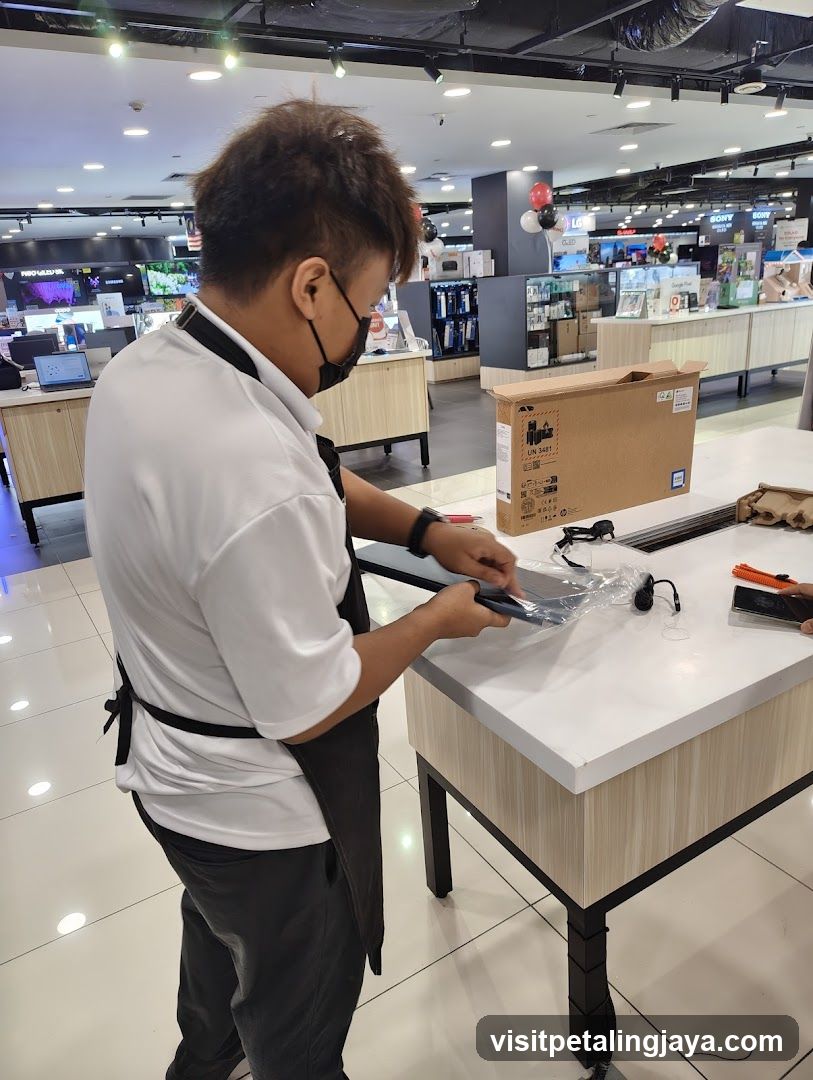 Store employee unpacking a product
