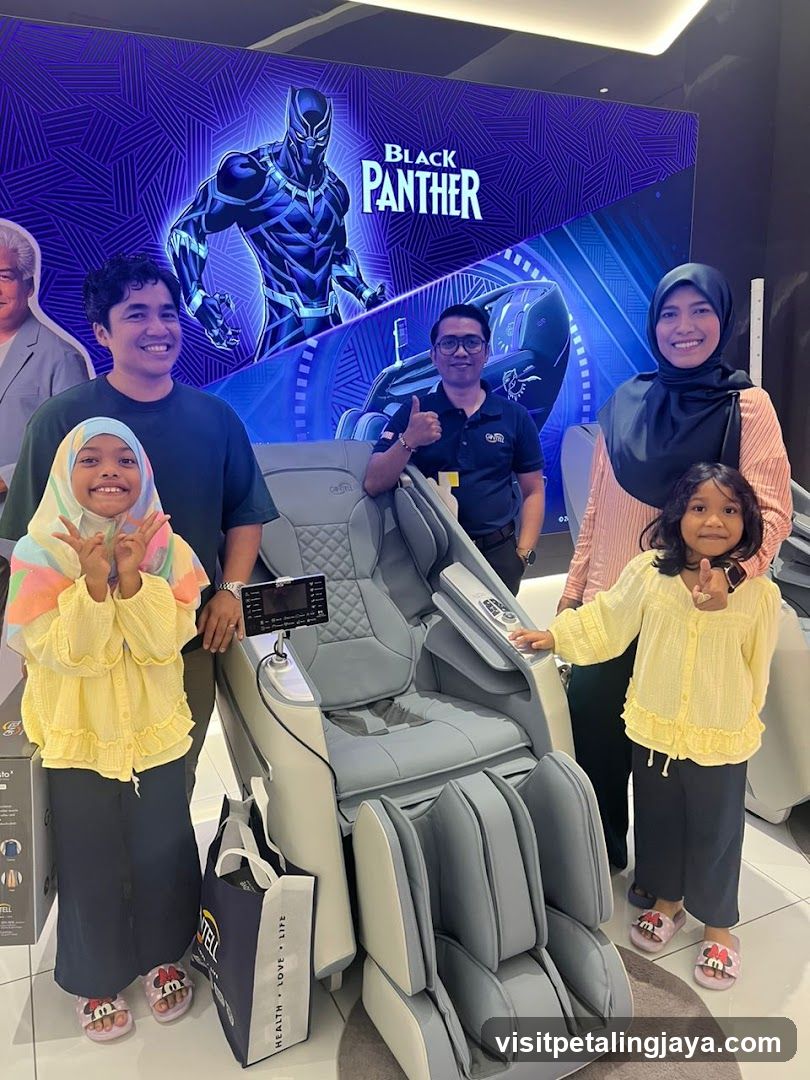 Family Poses with Massage Chair and Black Panther Display