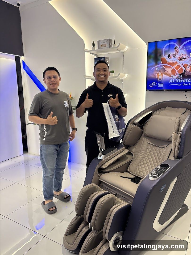 Two men with a massage chair