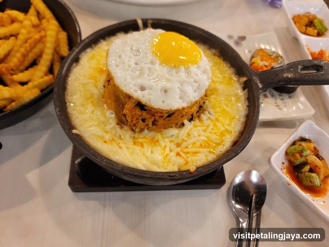 Cheesy Kimchi Fried Rice with Fried Egg and Fries