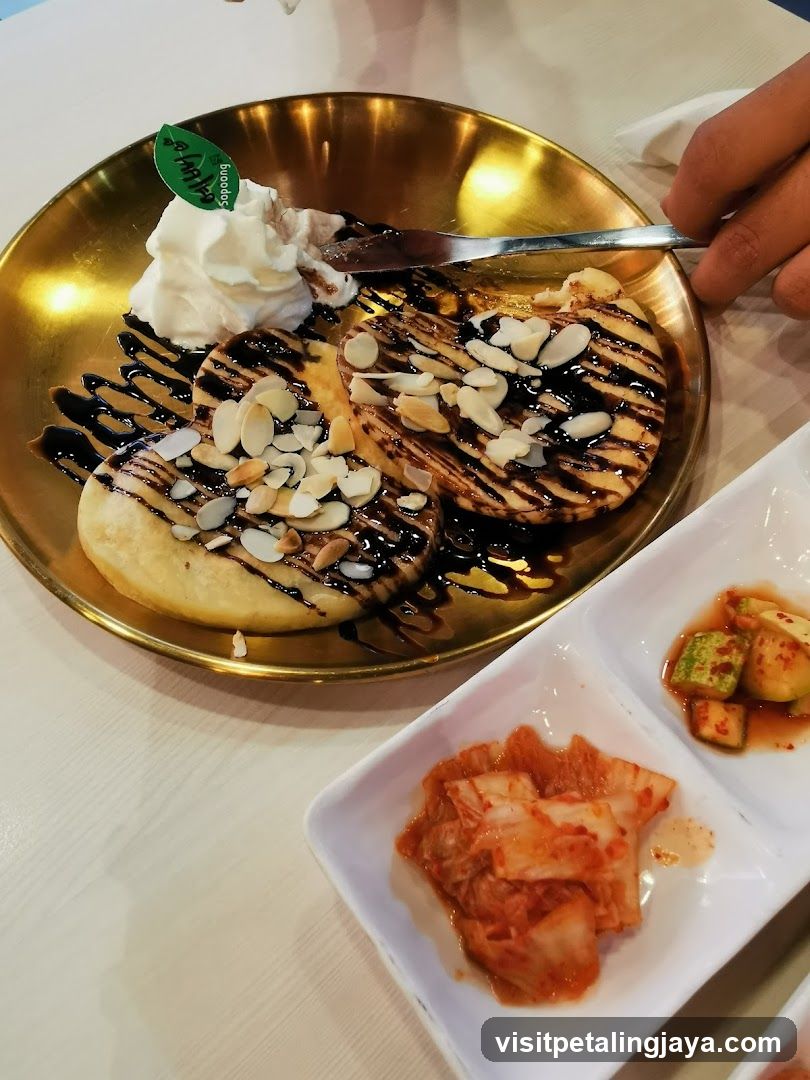 Pancakes with Whipped Cream and Almonds