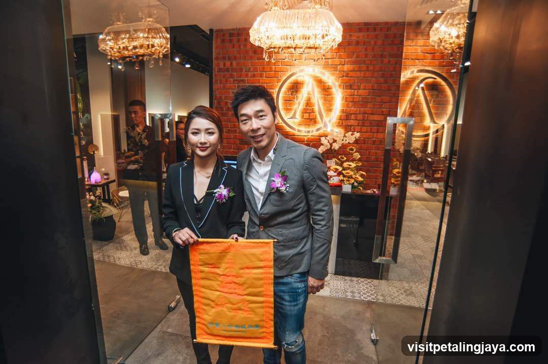 Two people holding a banner