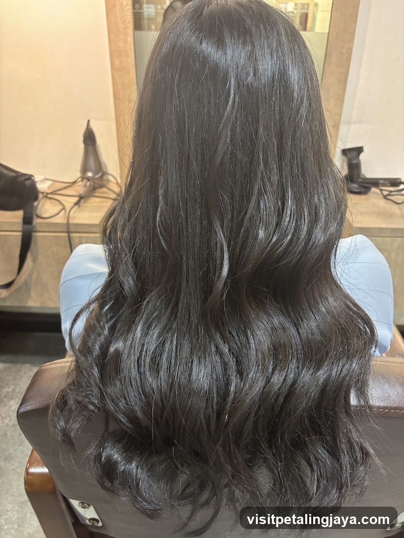 Woman with long, wavy dark hair
