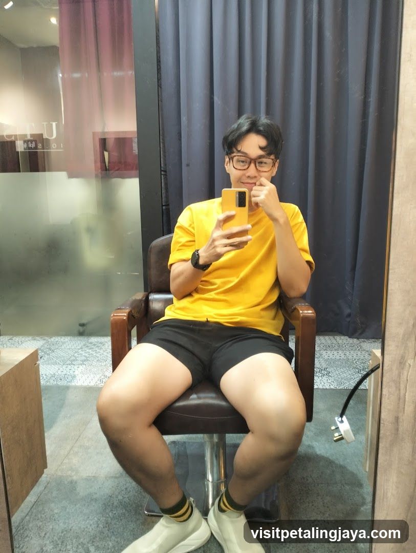 Man in Yellow Shirt Taking a Mirror Selfie