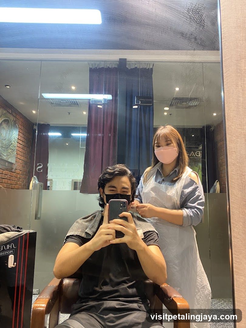 Man taking a selfie in a salon