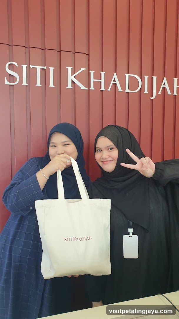 Two women with a tote bag