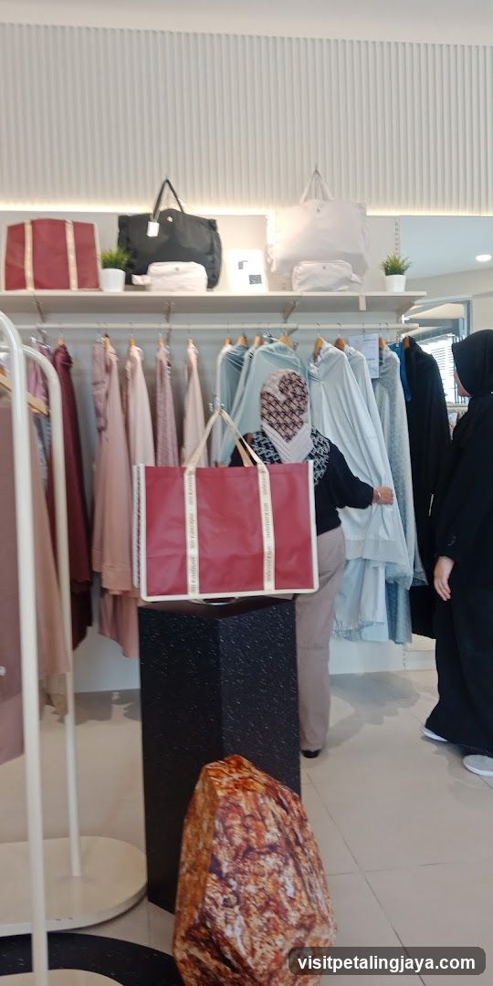 Clothing store interior with bags and apparel