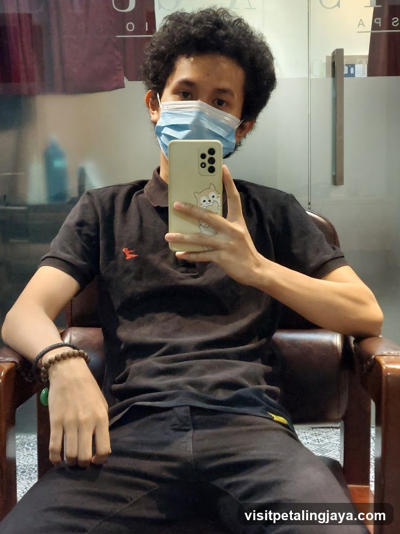 Man taking a selfie in a salon