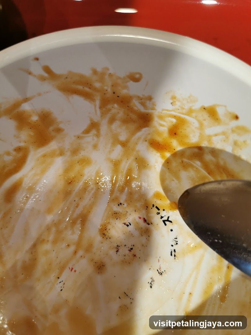 Dirty Bowl with Spoon