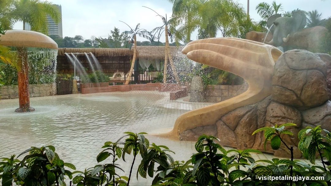 Water park splash pad with elephant slide