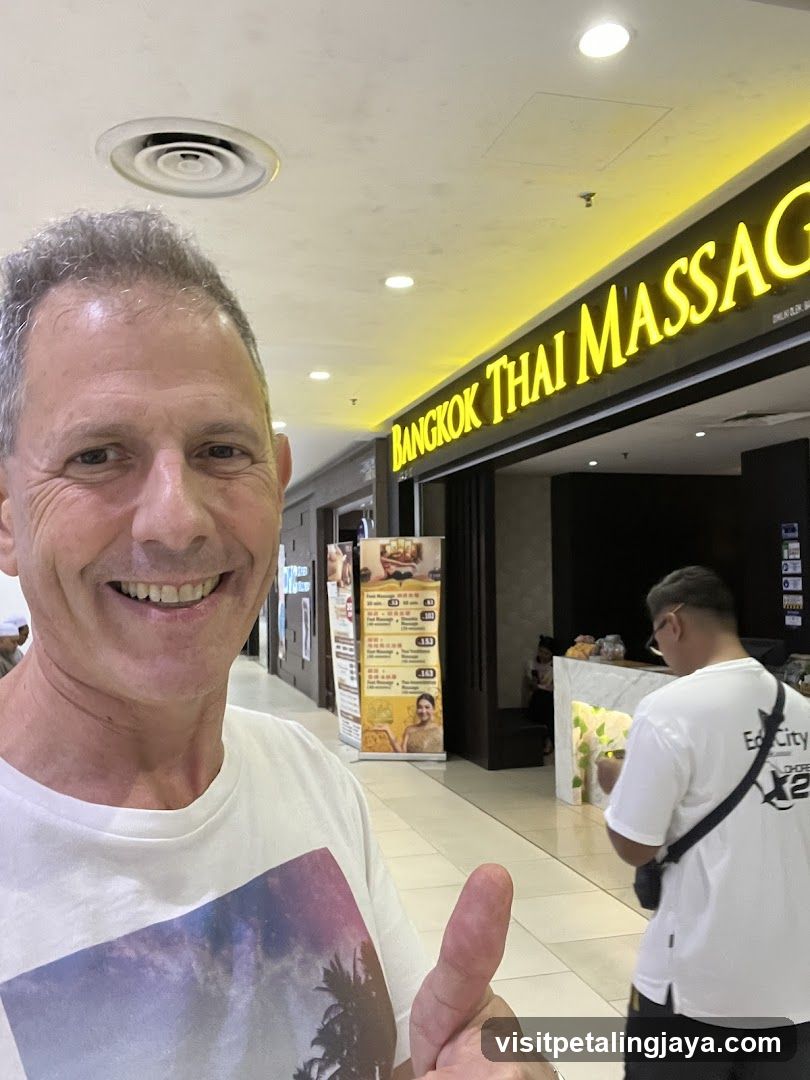 Man giving a thumbs up in front of a massage parlor
