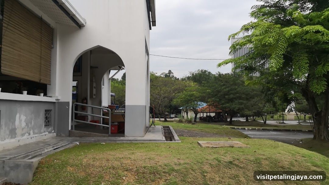 Outdoor walkway with trees and buildings