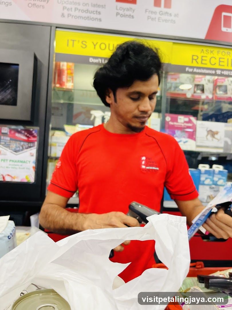 Pet Pharmacy Employee Scanning Items
