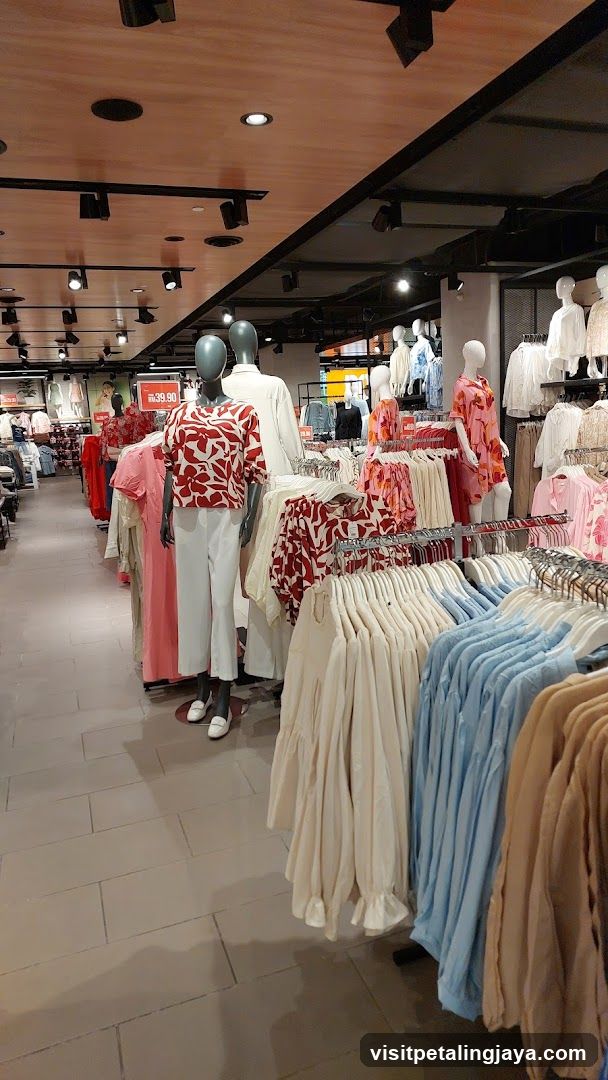 Clothing store interior with mannequins and apparel