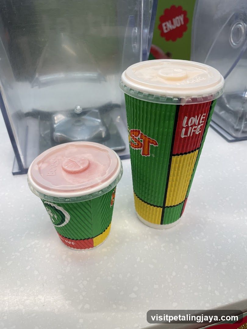 Two drinks with a blender in the background
