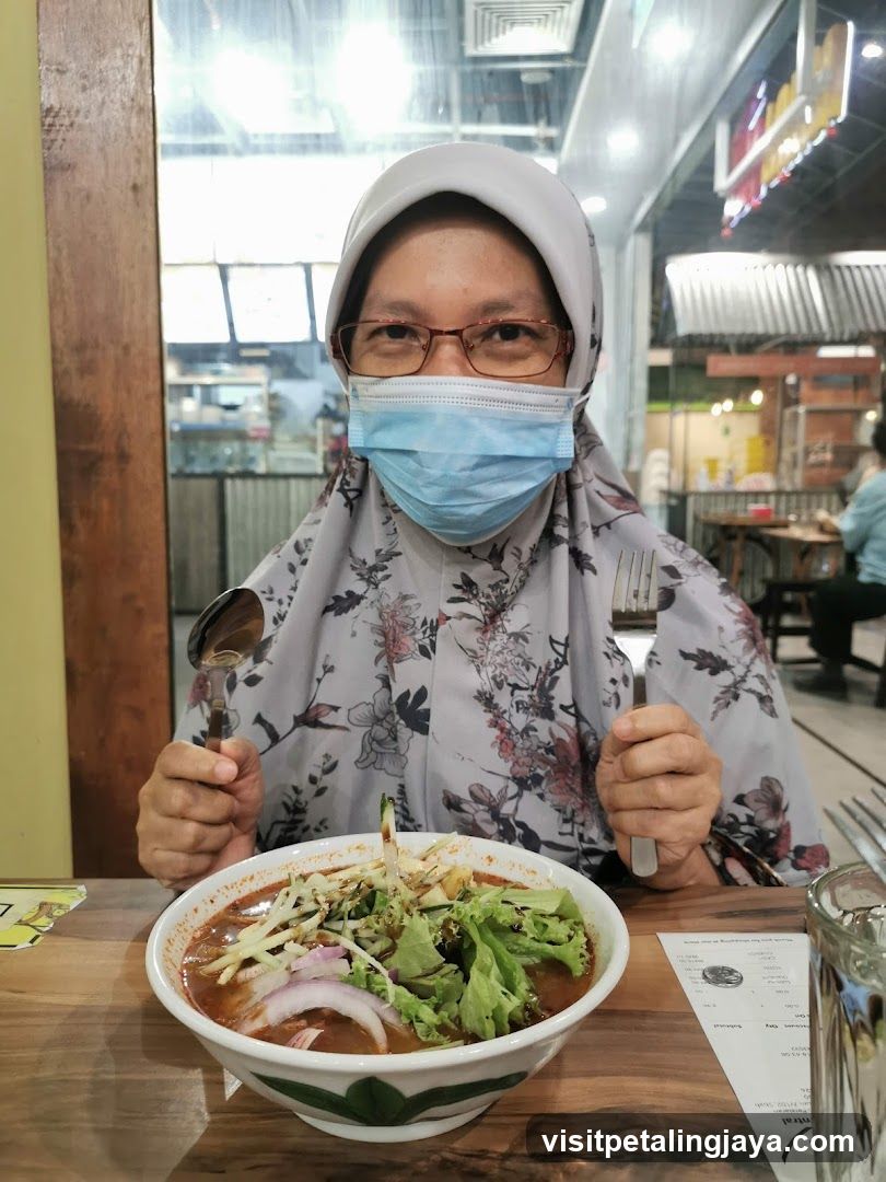 Woman with Mask Eating Noodles