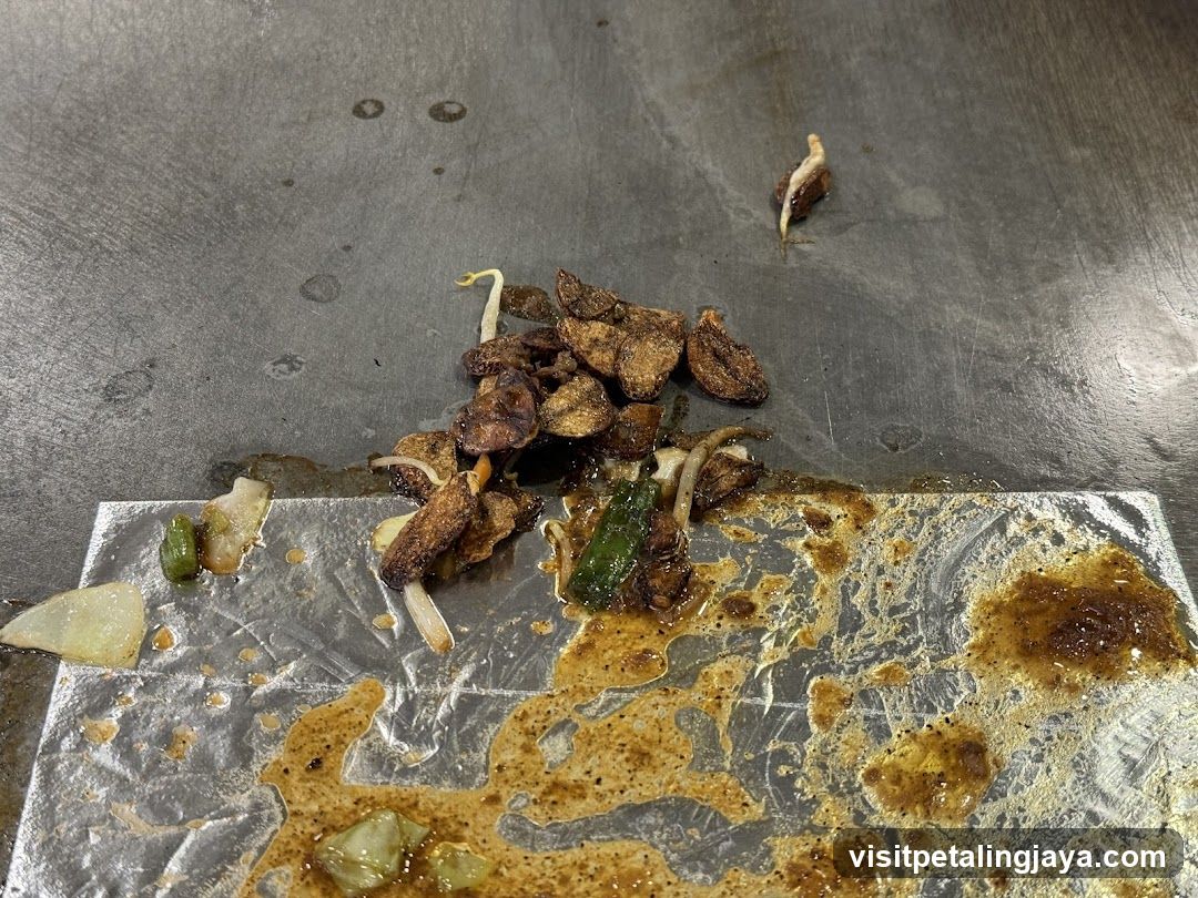 Cooked Food Scraps on Griddle