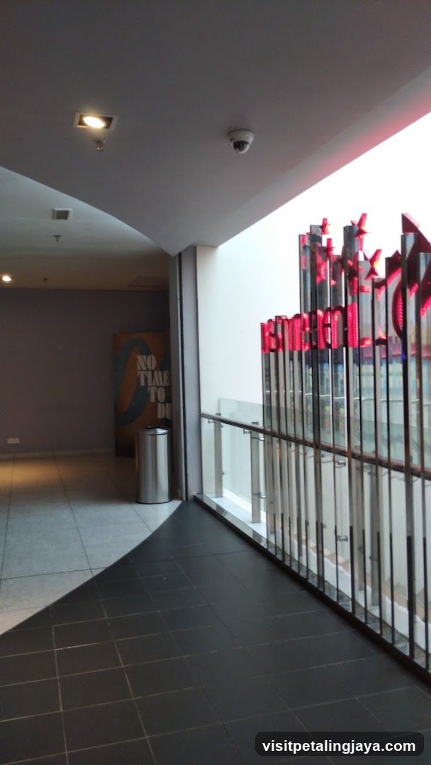 Interior hallway with movie poster and illuminated signage